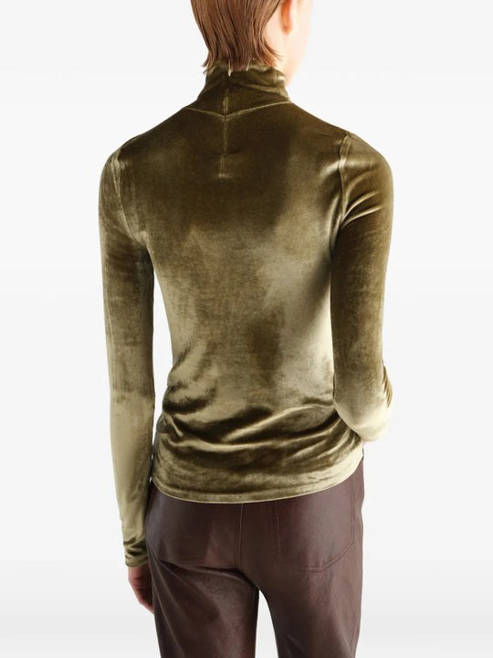 Green top worn by a person, showing the top fit