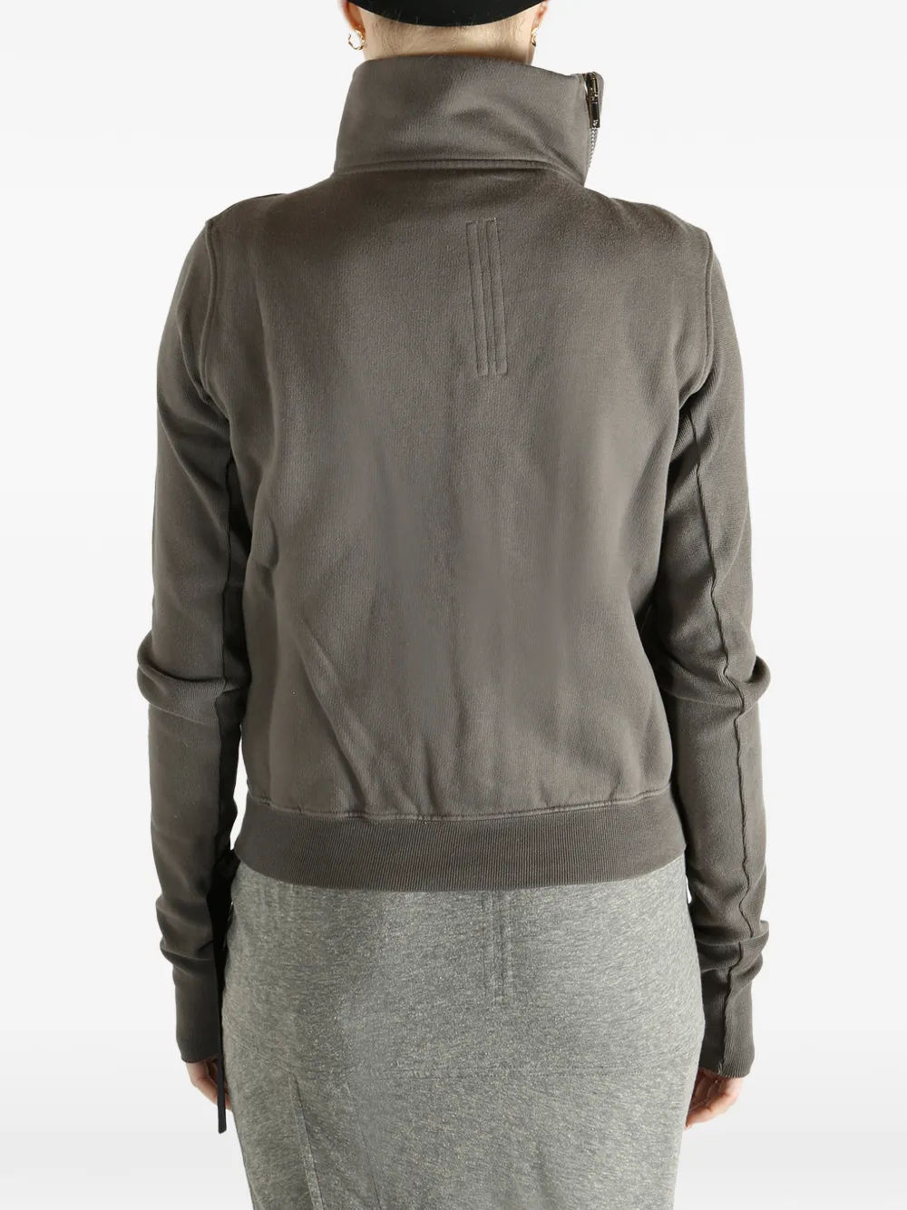 Grey sweat worn by a person, showing the sweat fit