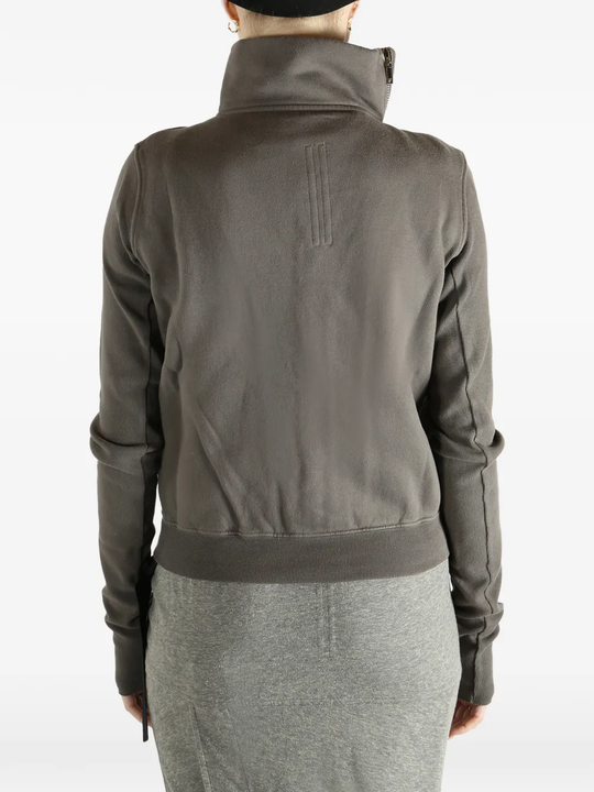Grey sweat worn by a person, showing the sweat fit