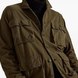 Green jacket worn by a person, showing the jacket fit