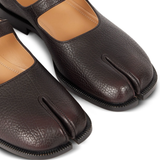 Close up of brown shoes, showing texture of the leather fabric