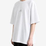 White t-shirt worn by a person, showing the t-shirt fit