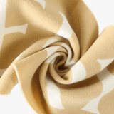 Close up of yeellow scarves, showing texture of the fabric