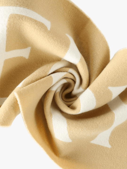 Close up of yeellow scarves, showing texture of the fabric