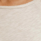 Close up of Tan t-shirt, showing texture of the 100% cotton fabric