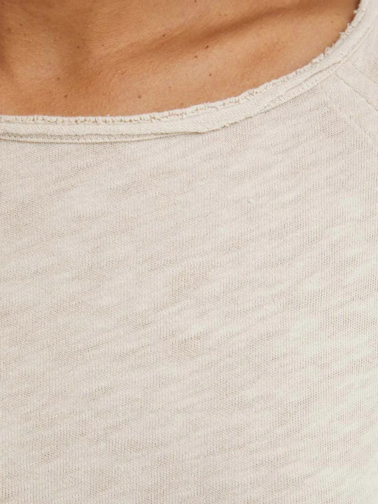 Close up of Tan t-shirt, showing texture of the 100% cotton fabric