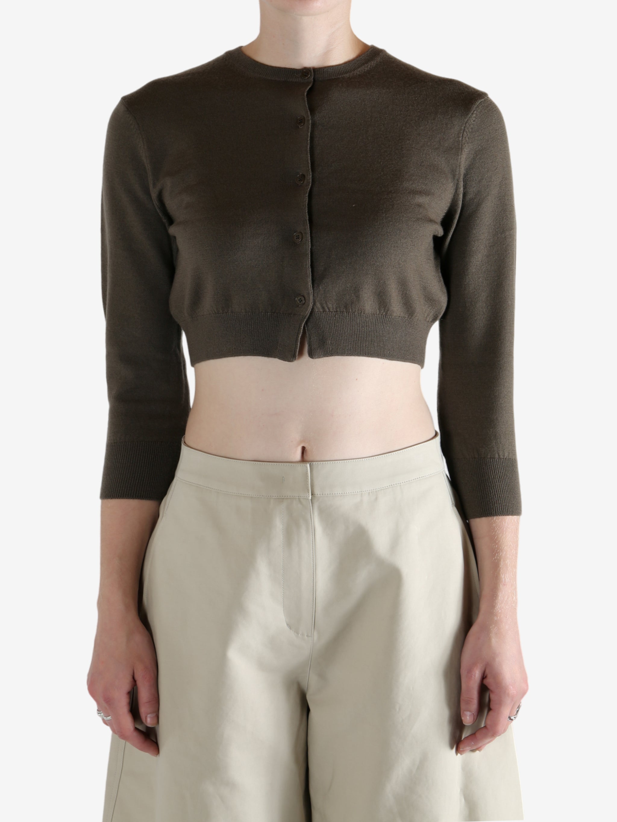 Brown cardigan worn by a person, showing the cardigan's fit