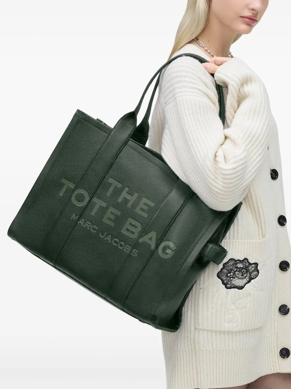 Green bag worn by a person, showing the bag's fit