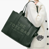 Green bag worn by a person, showing the bag's fit