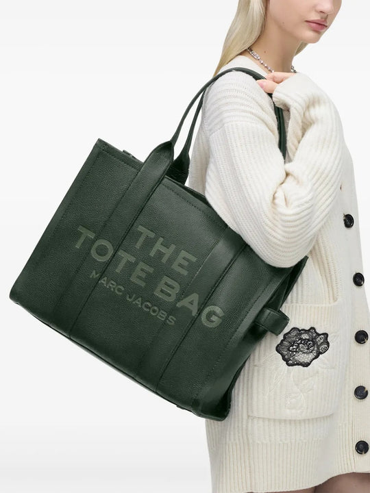 Green bag worn by a person, showing the bag's fit