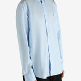 Blue shirt worn by a person, showing the shirt's fit