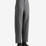 Grey pants worn by a person, showing the pants fit