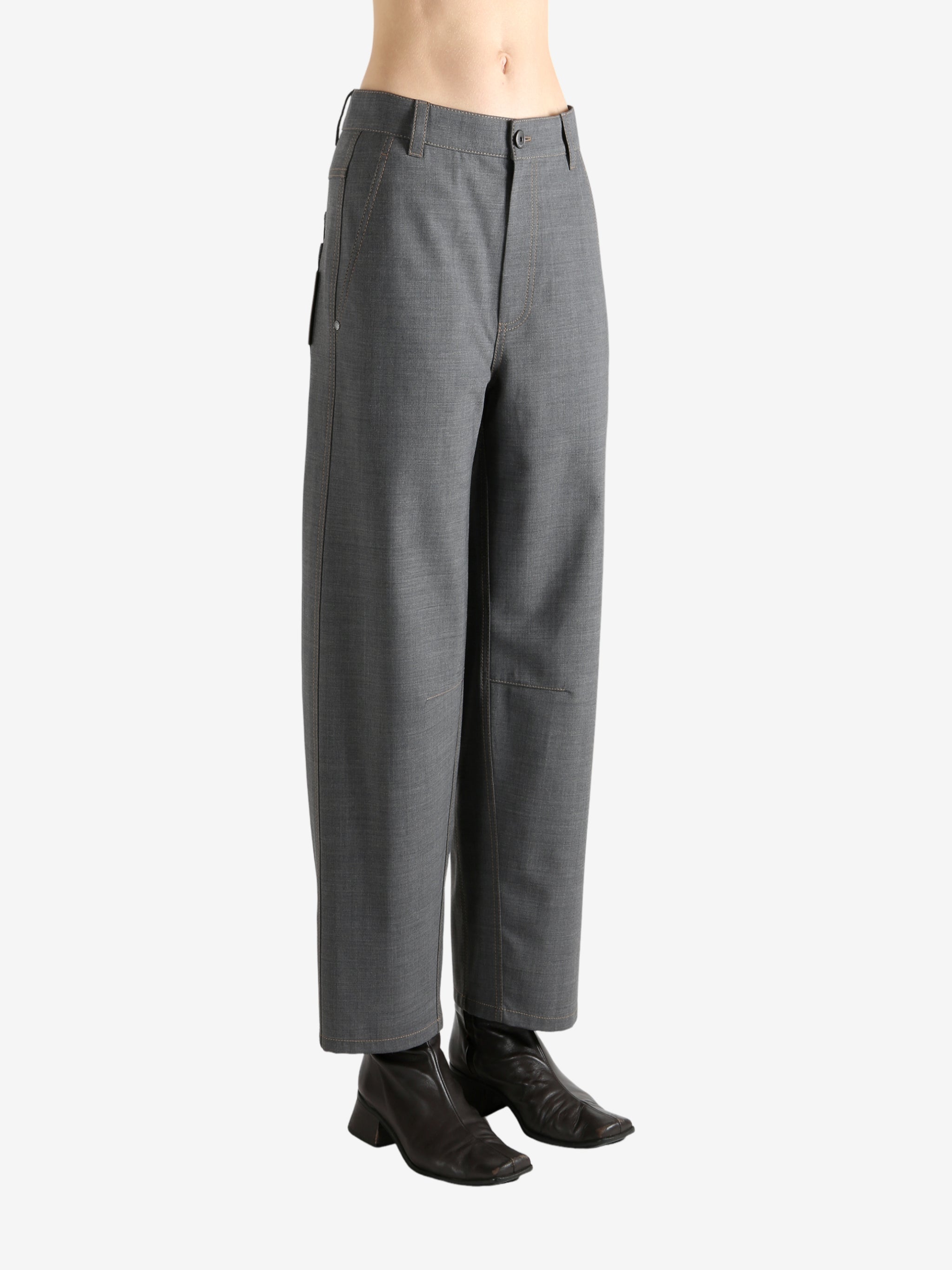 Grey pants worn by a person, showing the pants fit
