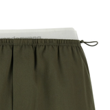 Close up of green skirts, showing texture of the Cotton fabric