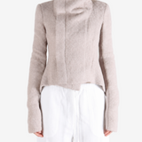 Tan jacket worn by a person, showing the jacket fit