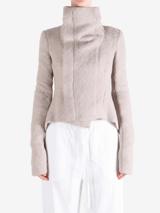 Tan jacket worn by a person, showing the jacket fit