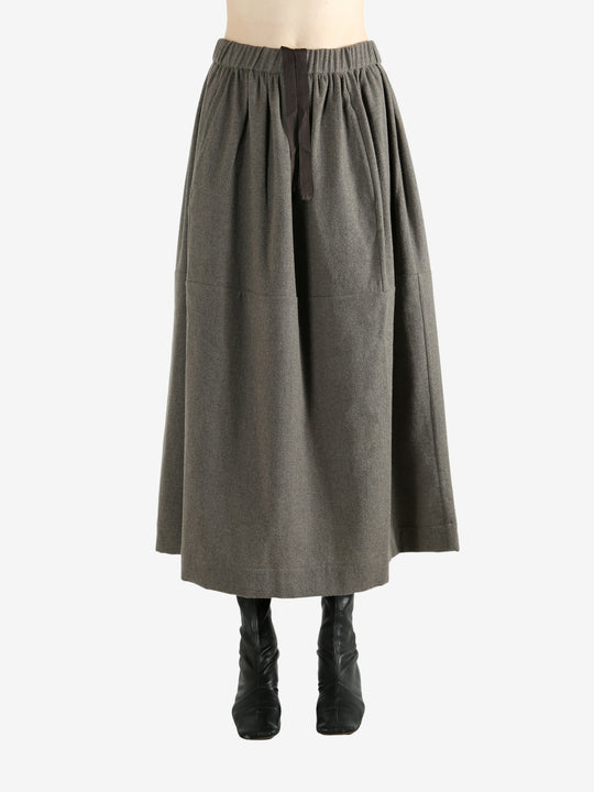 Grey skirt worn by a person, showing the skirt fit