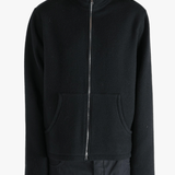 Black jacket worn by a person, showing the jacket's fit