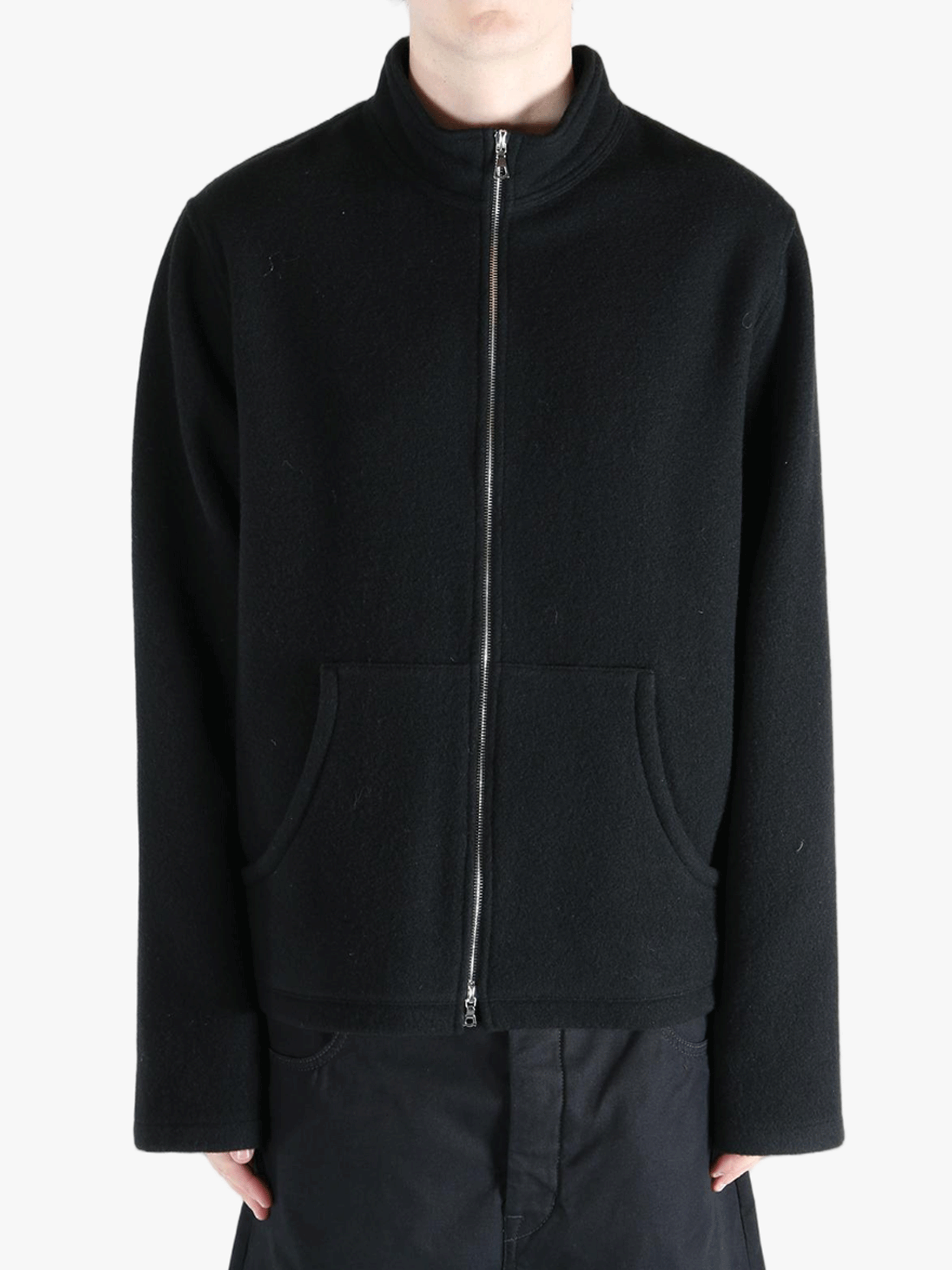 Black jacket worn by a person, showing the jacket's fit