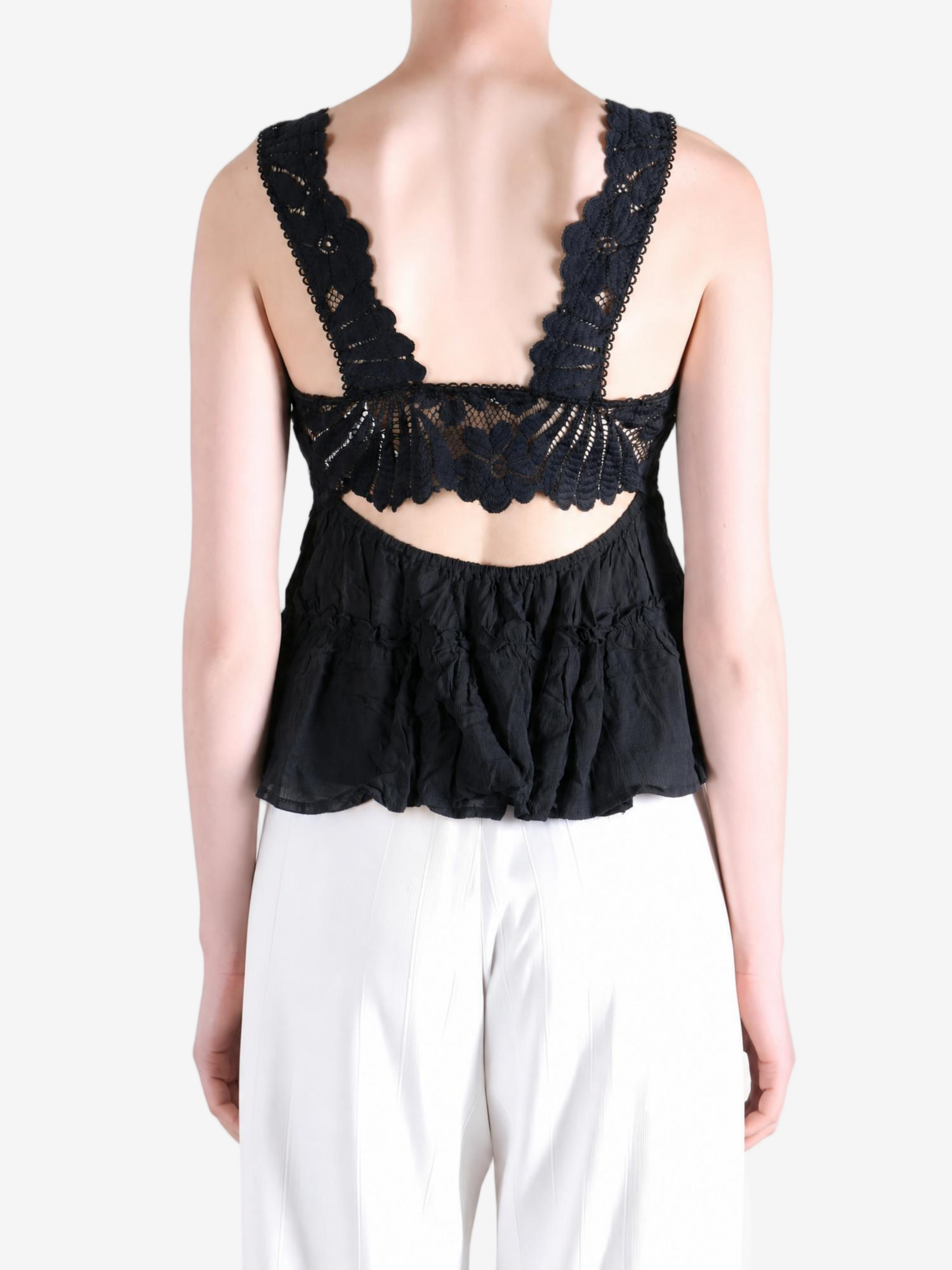 Black top worn by a person, showing the top fit