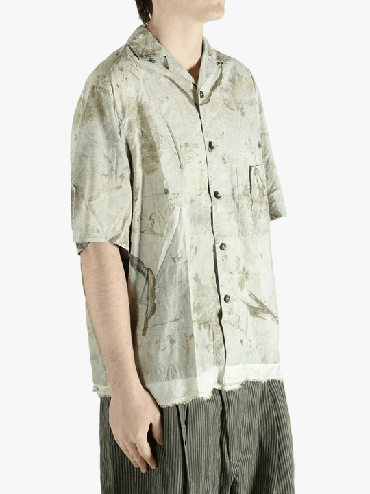 Green shirt worn by a person, showing the shirt's fit