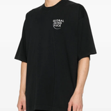 black t-shirt worn by a person, showing the t-shirt fit