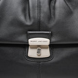 Close up of the black bag, showing texture of the leather fabric