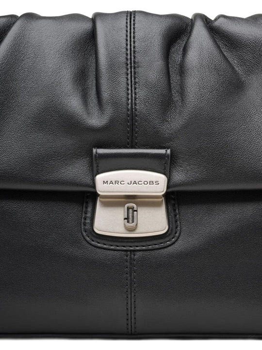 Close up of the black bag, showing texture of the leather fabric
