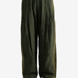 Green pants worn by a person, showing the pants'fit