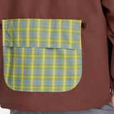 Close up of red jacket, showing texture of the recycled polyester fabric