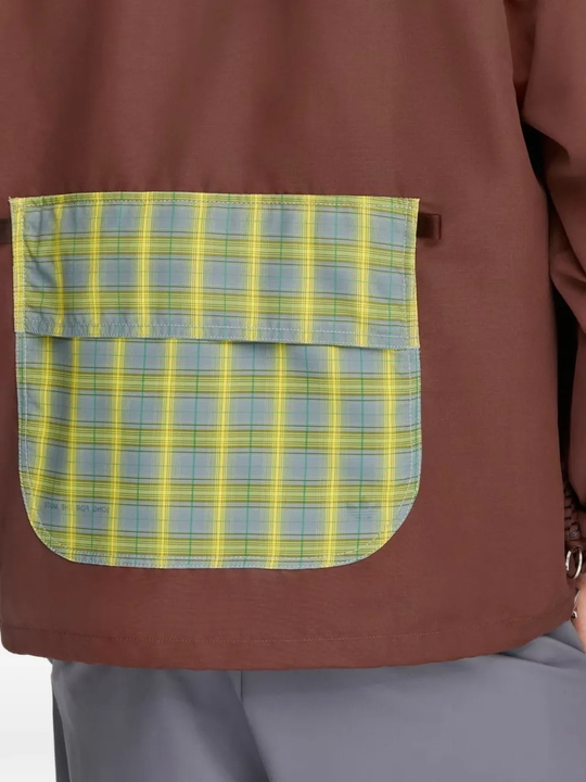 Close up of red jacket, showing texture of the recycled polyester fabric