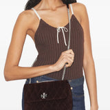 Brown bags worn by a person, showing the bags' fit 