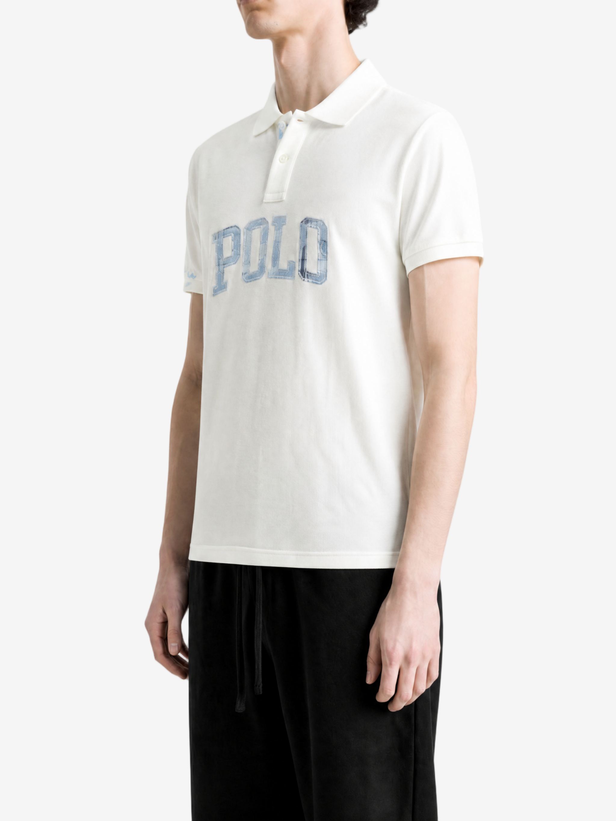 White t-shirt worn by a person, showing the t-shirt fit