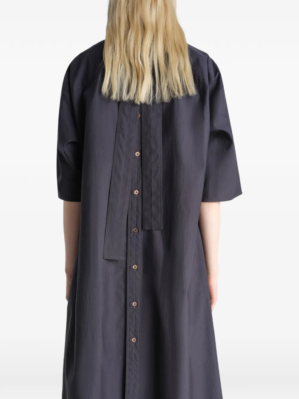Black dresses worn by a person, showing the dresses fit