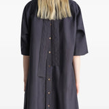 Black dresses worn by a person, showing the dresses fit
