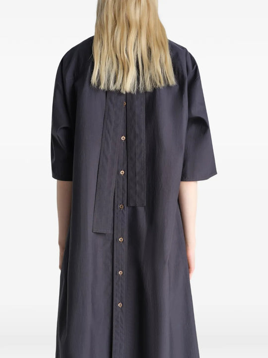 Black dresses worn by a person, showing the dresses fit
