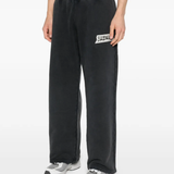 black pants worn by a person, showing the pants fit