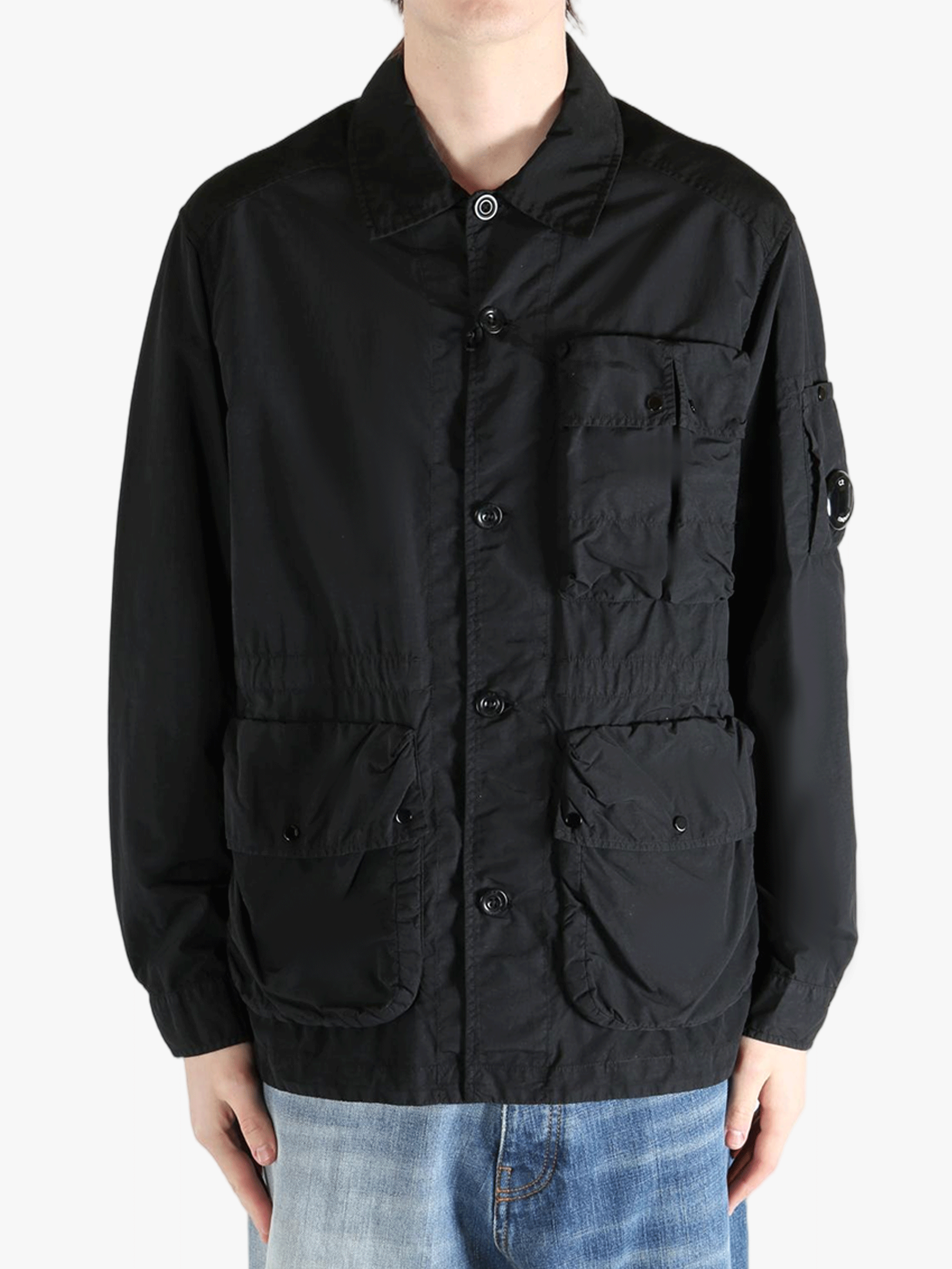 Black jacket worn by a person, showing the jacket fit