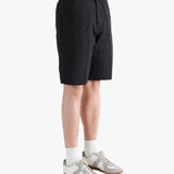 Black shorts worn by a person, showing the shorts fit
