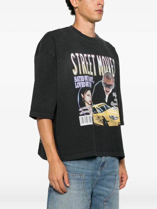 Black t-shirt worn by a person, showing the t-shirt fit
