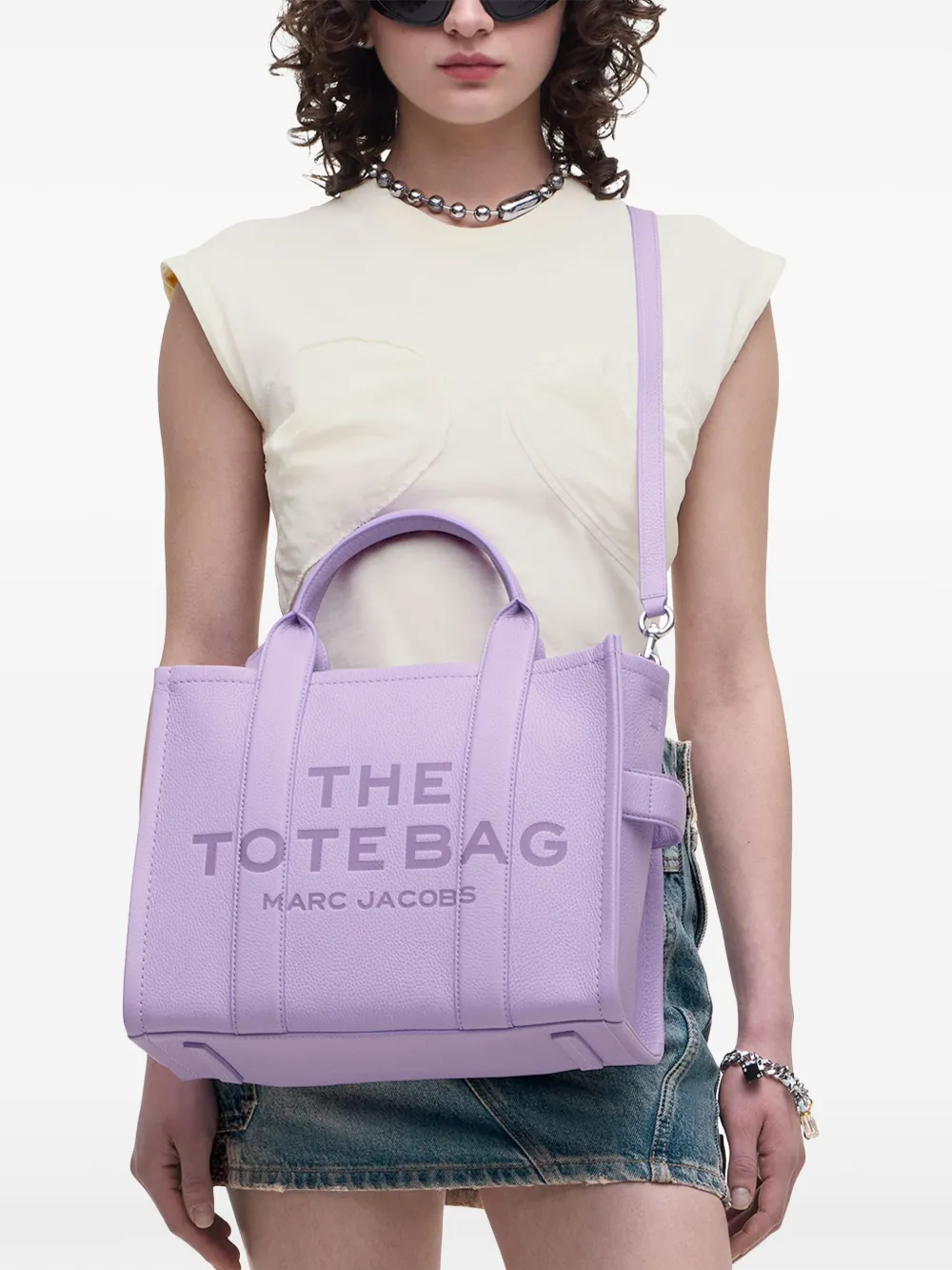Purple bag worn by a person, showing the bag's fit