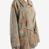 Orange jacket worn by a person, showing the jacket fit