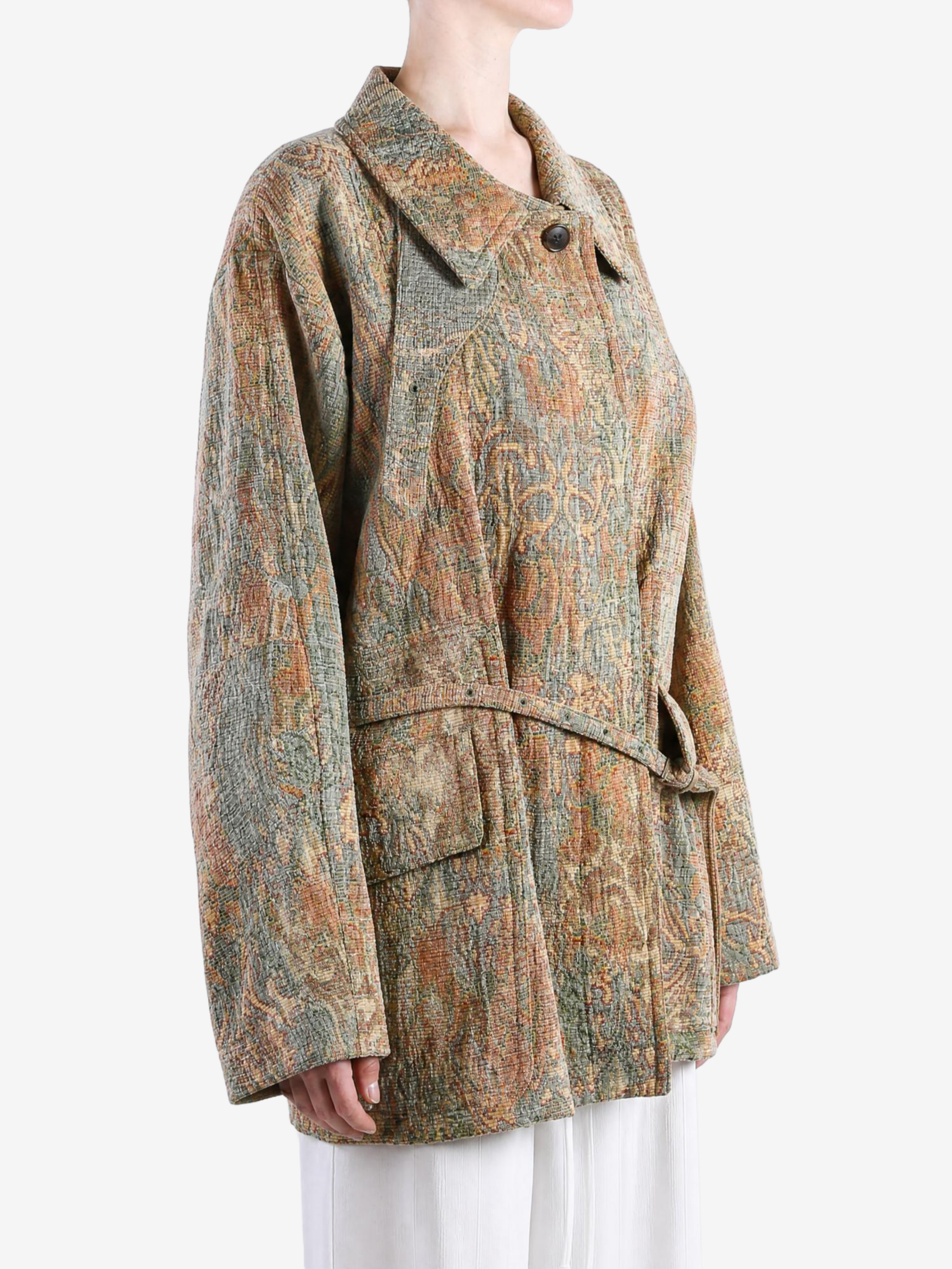 Orange jacket worn by a person, showing the jacket fit