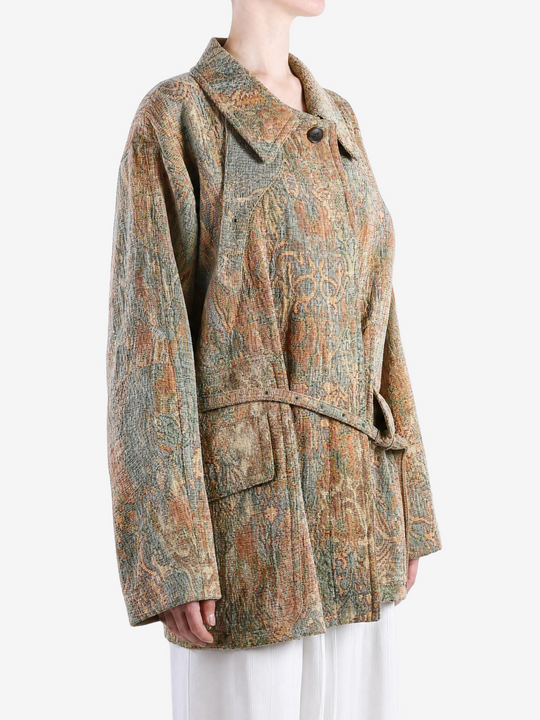 Orange jacket worn by a person, showing the jacket fit