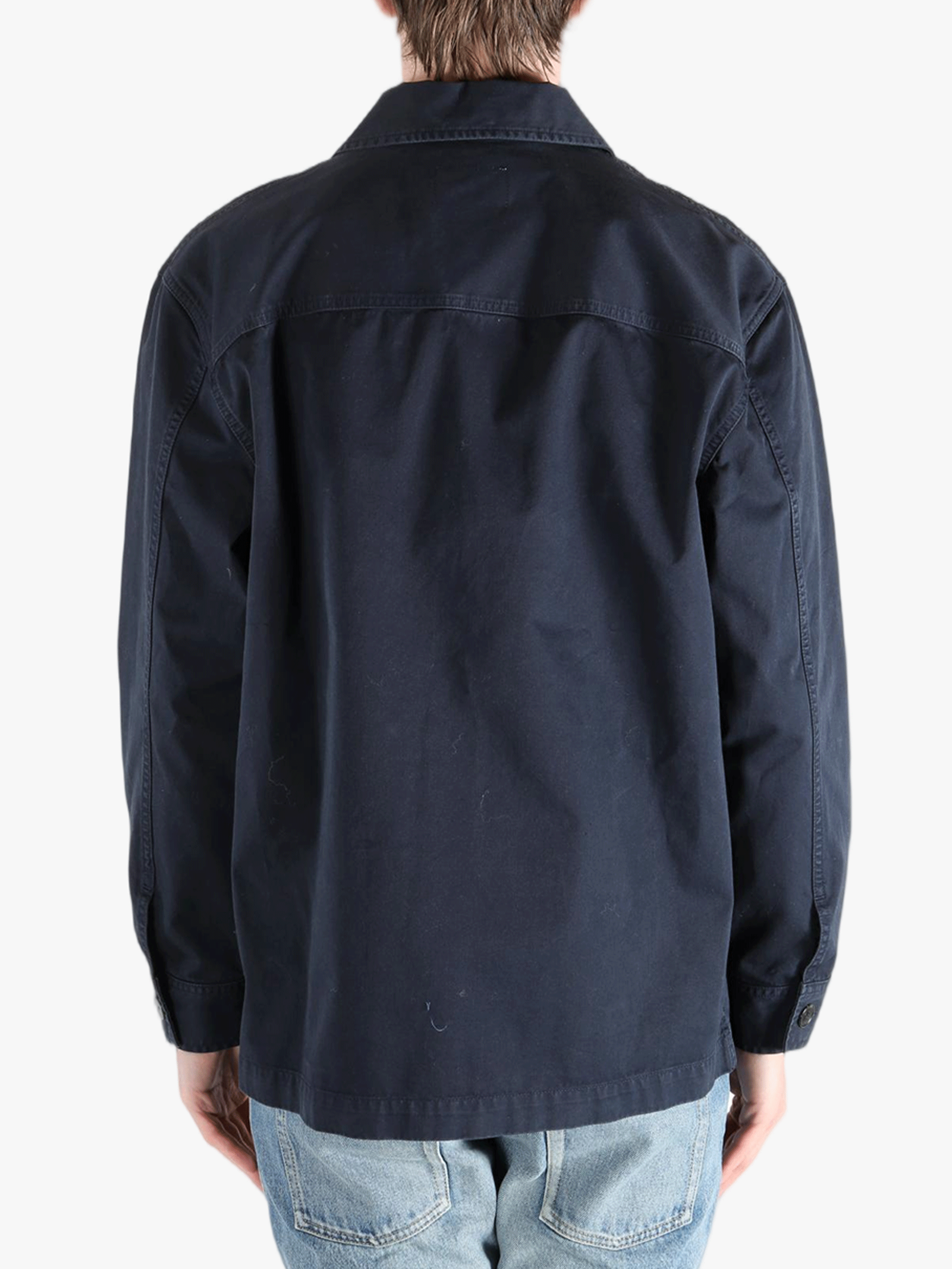 Navy shirts worn by a person, showing the shirts fit