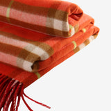 Close up of red scarf, showing texture of the wool fabric