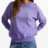 Purple sweatshirt worn by a person, showing the sweatshirt's fit