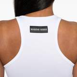 Close up of white top, showing texture of the orangic cotton fabric