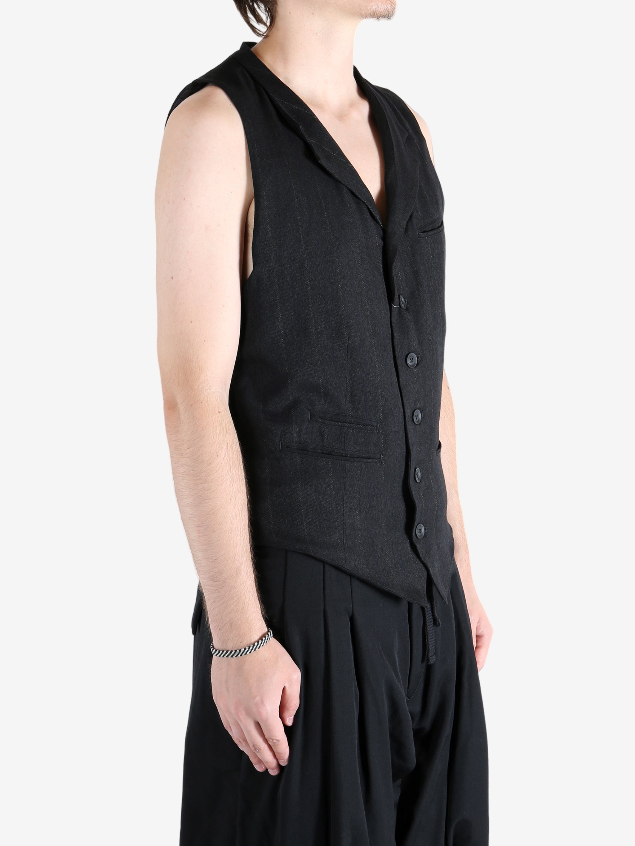 Black vest worn by a person, showing the vest fit