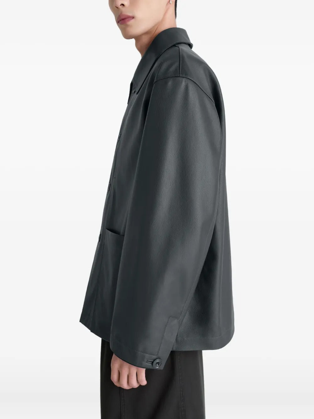 Black jacket worn by a person, showing the jacket's fit